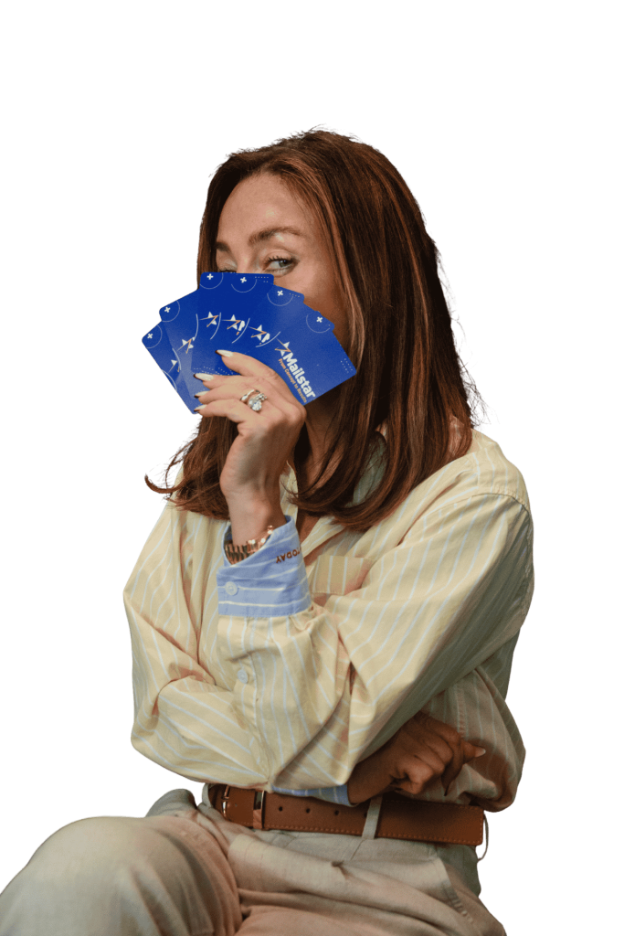 Tatiana holding a fan of Mailstar-branded playing cards